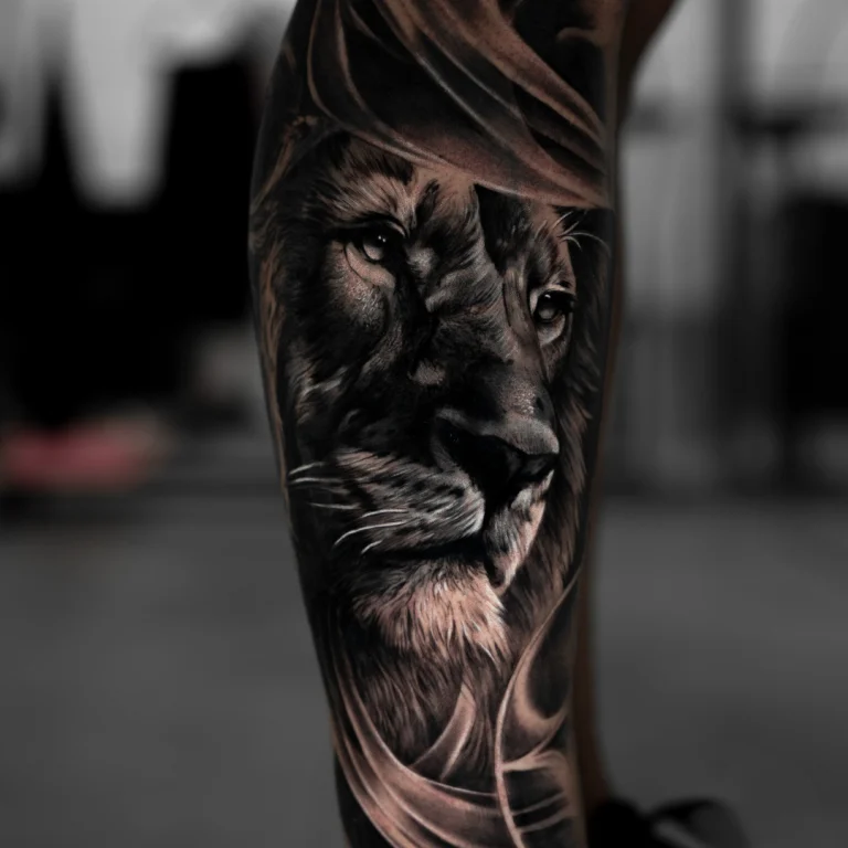 lkion tattoo black and grey